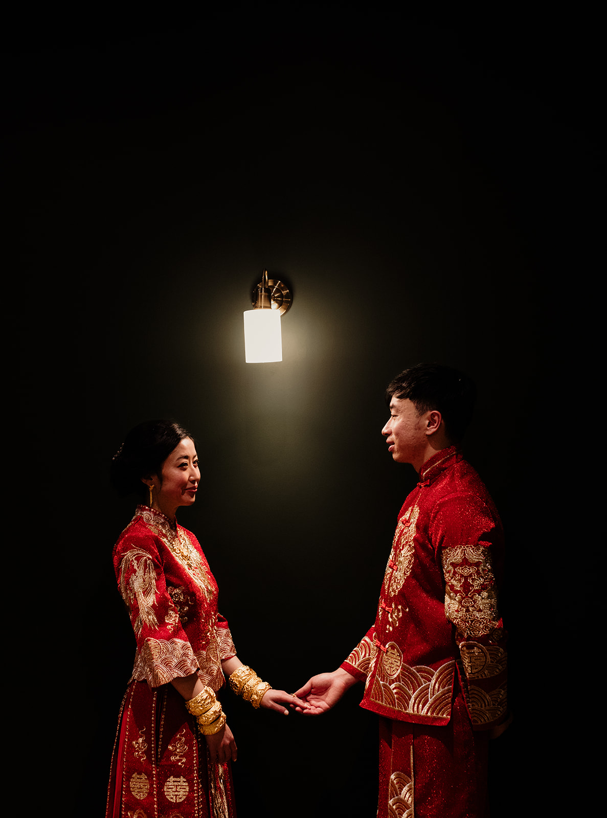 Fiona and Nhan holding hands during their wedding celebrations