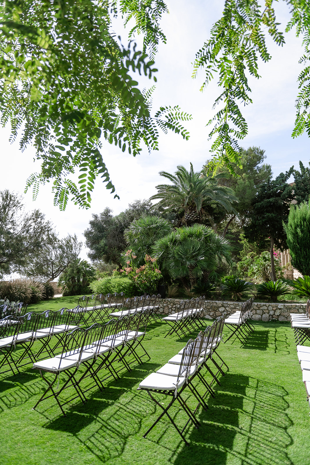 The modernist facade and garden fountain of Xalet del Nin on the wedding morning