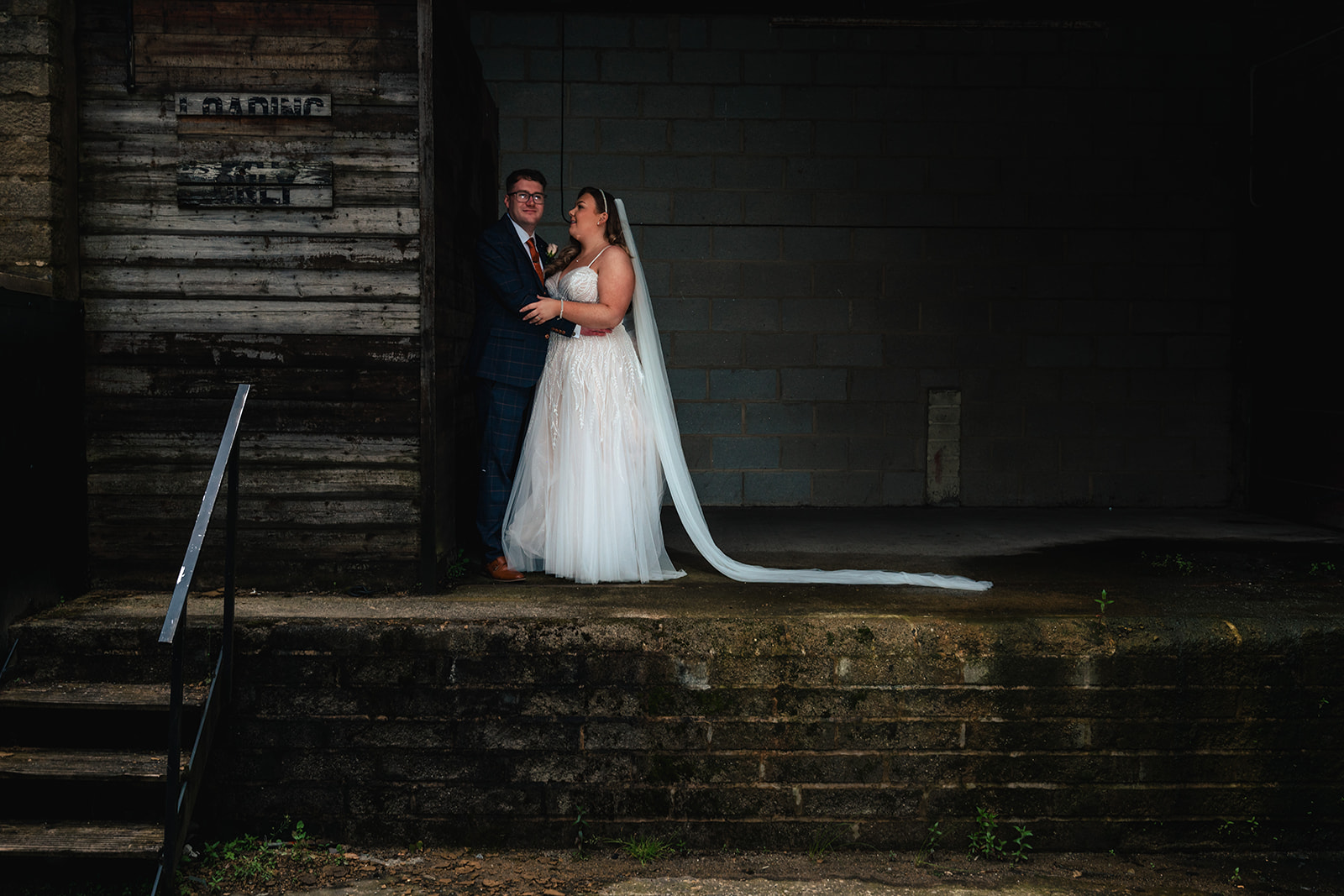 Hollie and Matthew together on the mill staircase at Bowers Mill
