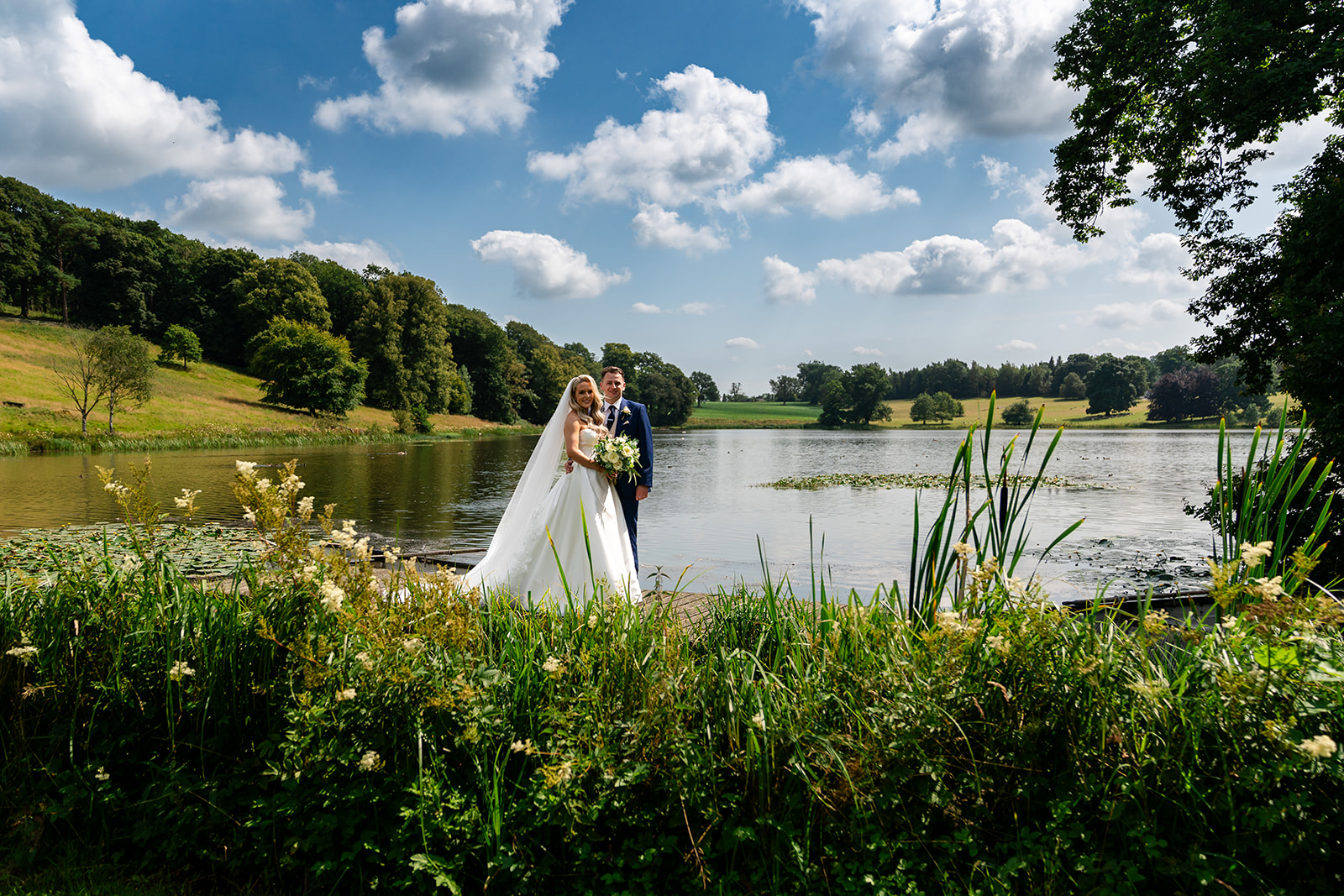 Ashley and David beside the lake at the Coniston Hotel