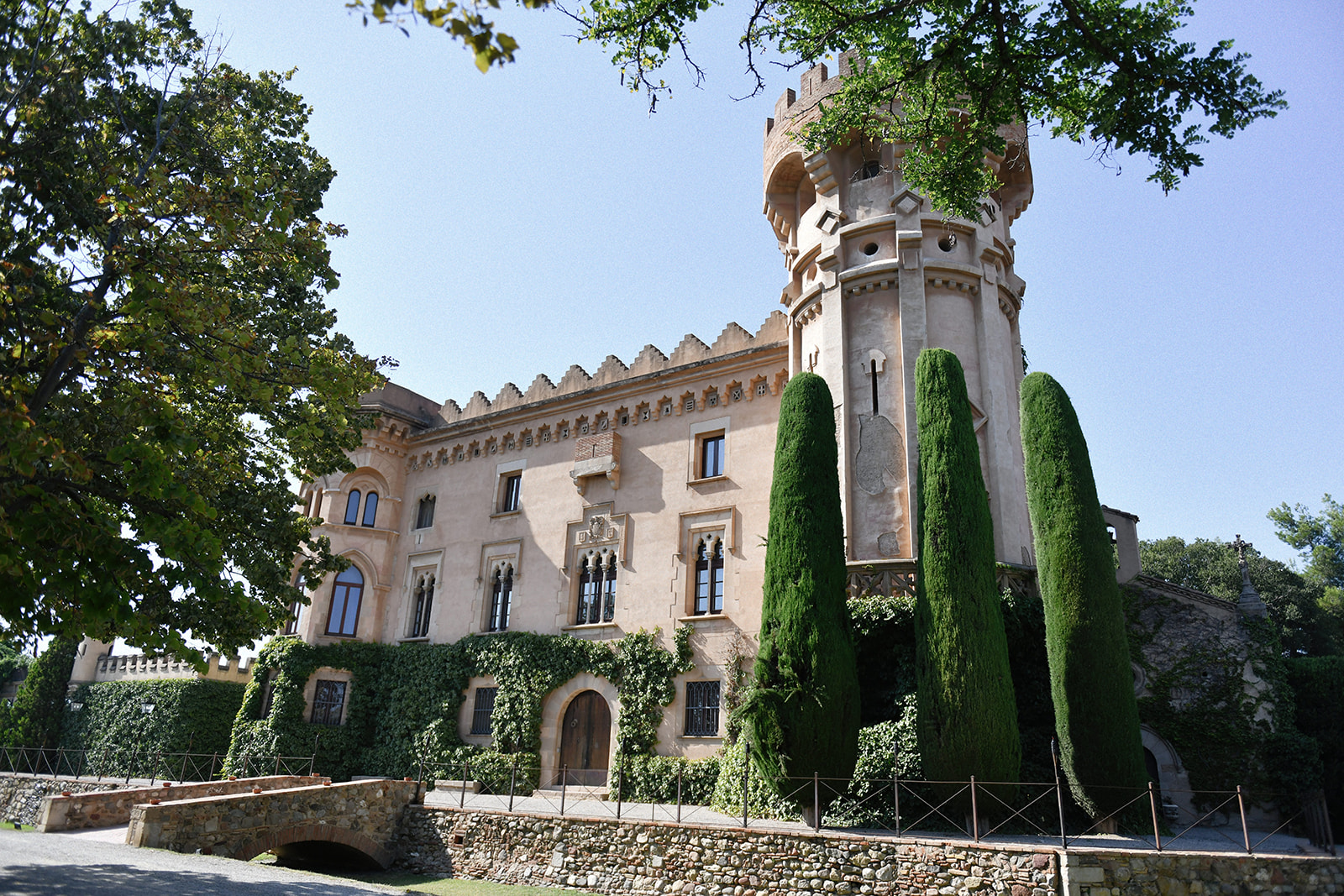 Castell de Sant Marçal facade with cypress trees on the wedding day