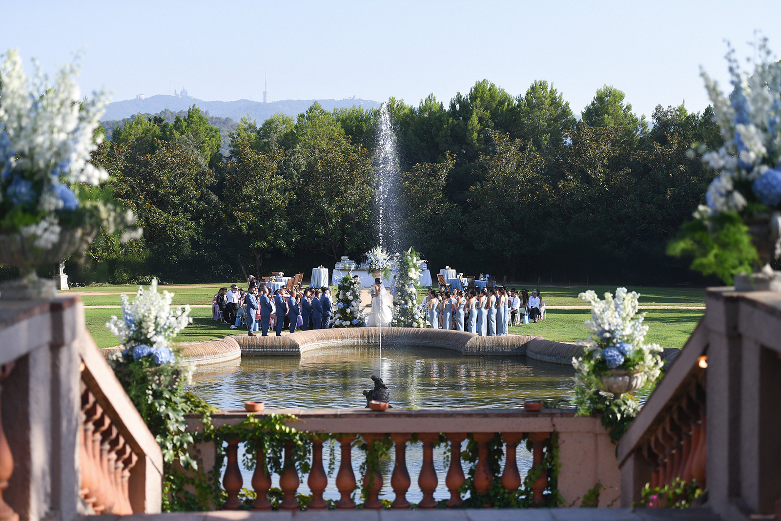 Wedding guests around the fountain terrace at Castell de Sant Marçal