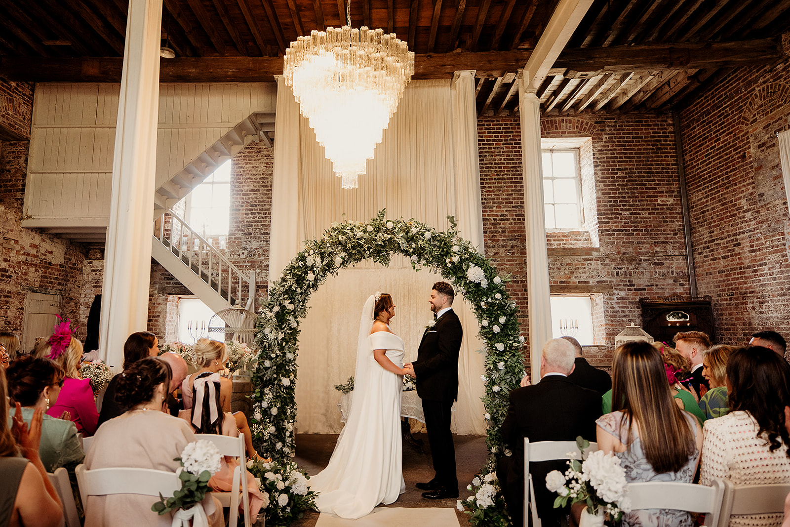 Isabel and Adam exchanging vows in the Old Mill ceremony room