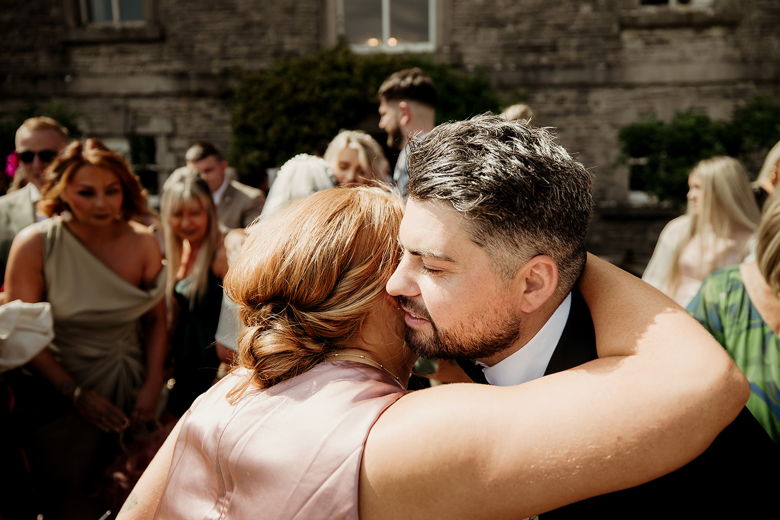A hug after Isabel and Adam’s ceremony at The Millhouse