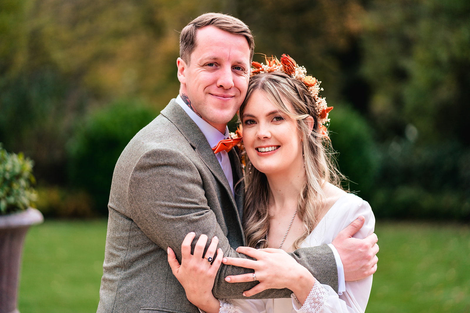 Helena and Liam smiling together during autumn portraits at Woodlands Hotel