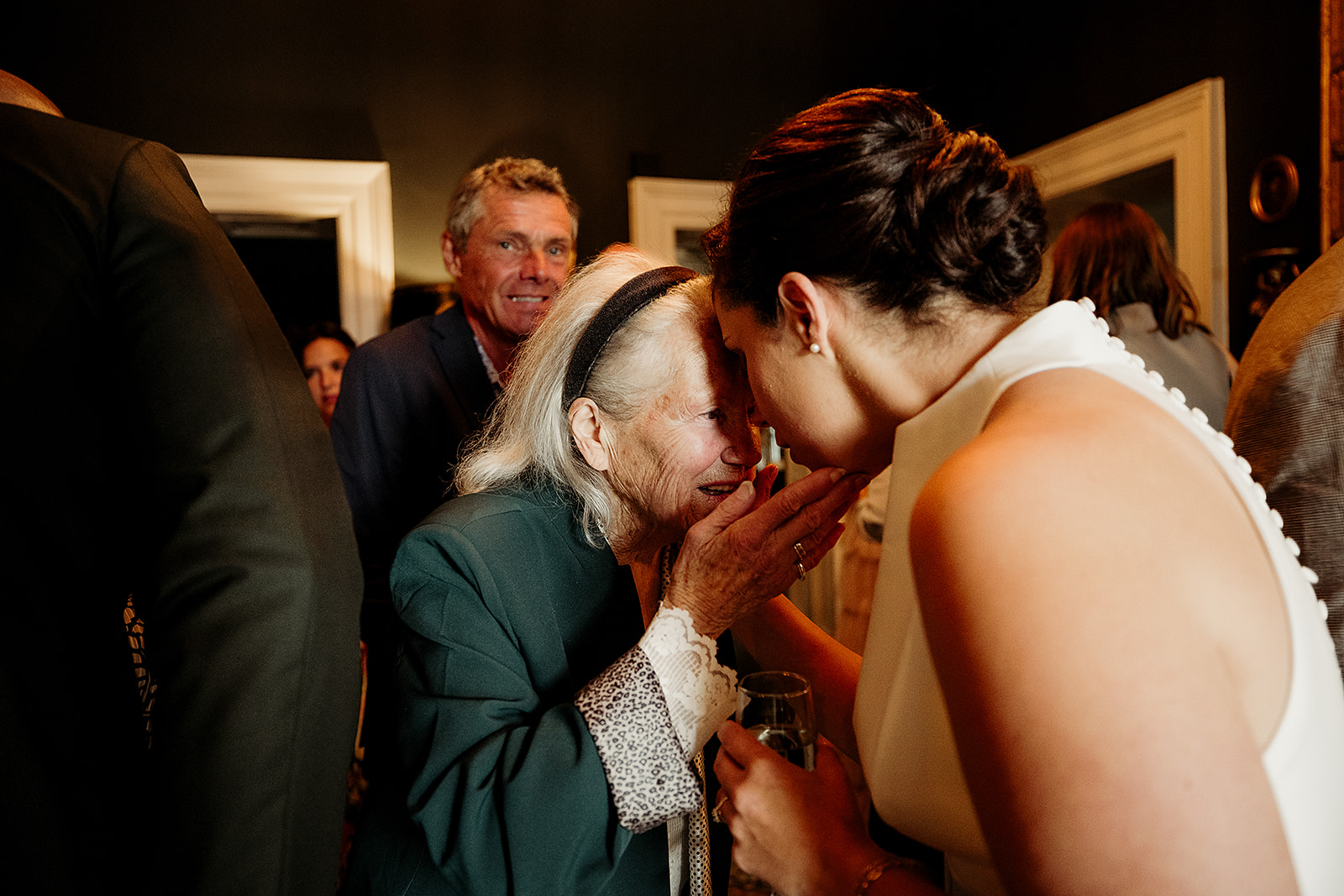 Marine shares a quiet moment with a wedding guest at Boyne Hill House.