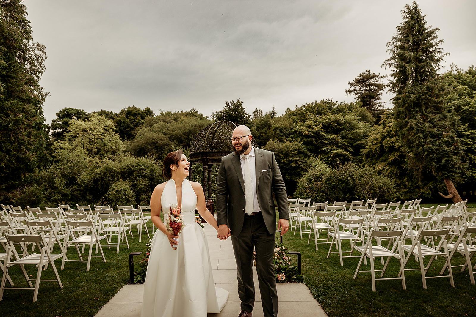 Marine and David laughing together in the Secret Garden at Boyne Hill House.