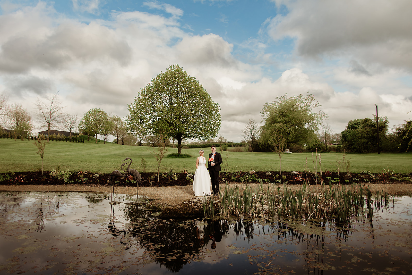 Lorna and Craig beside the pond in the grounds of Clonabreany House.