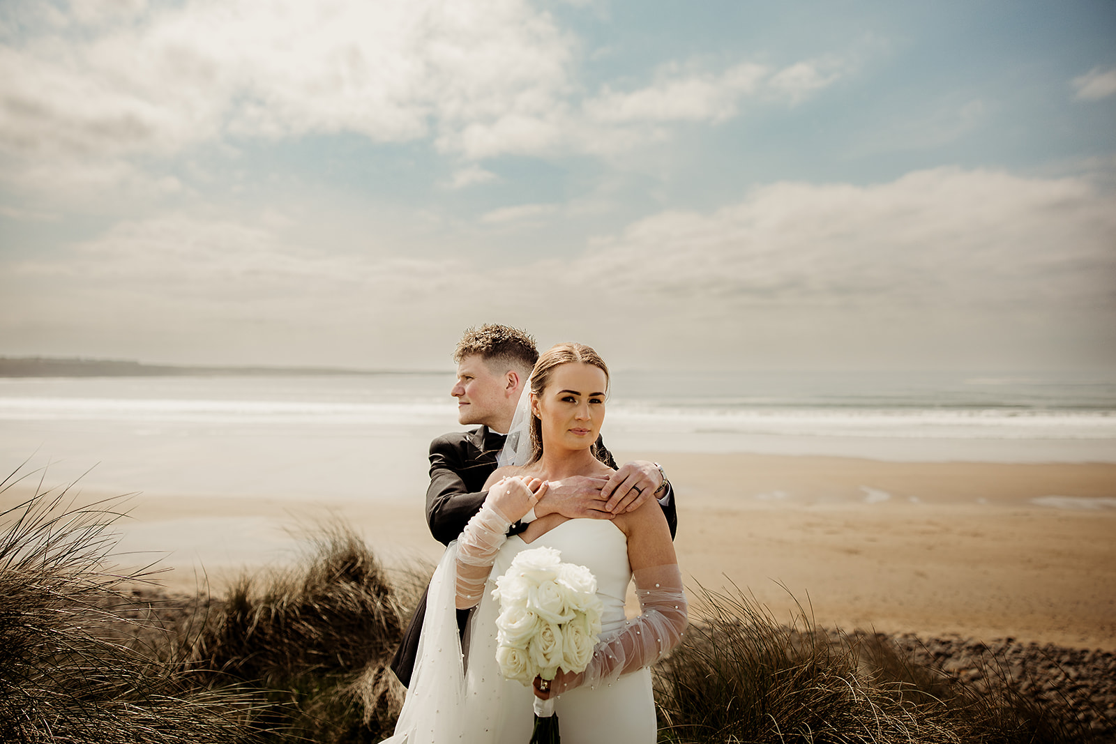 A quiet portrait of Alison and Ross above the beach