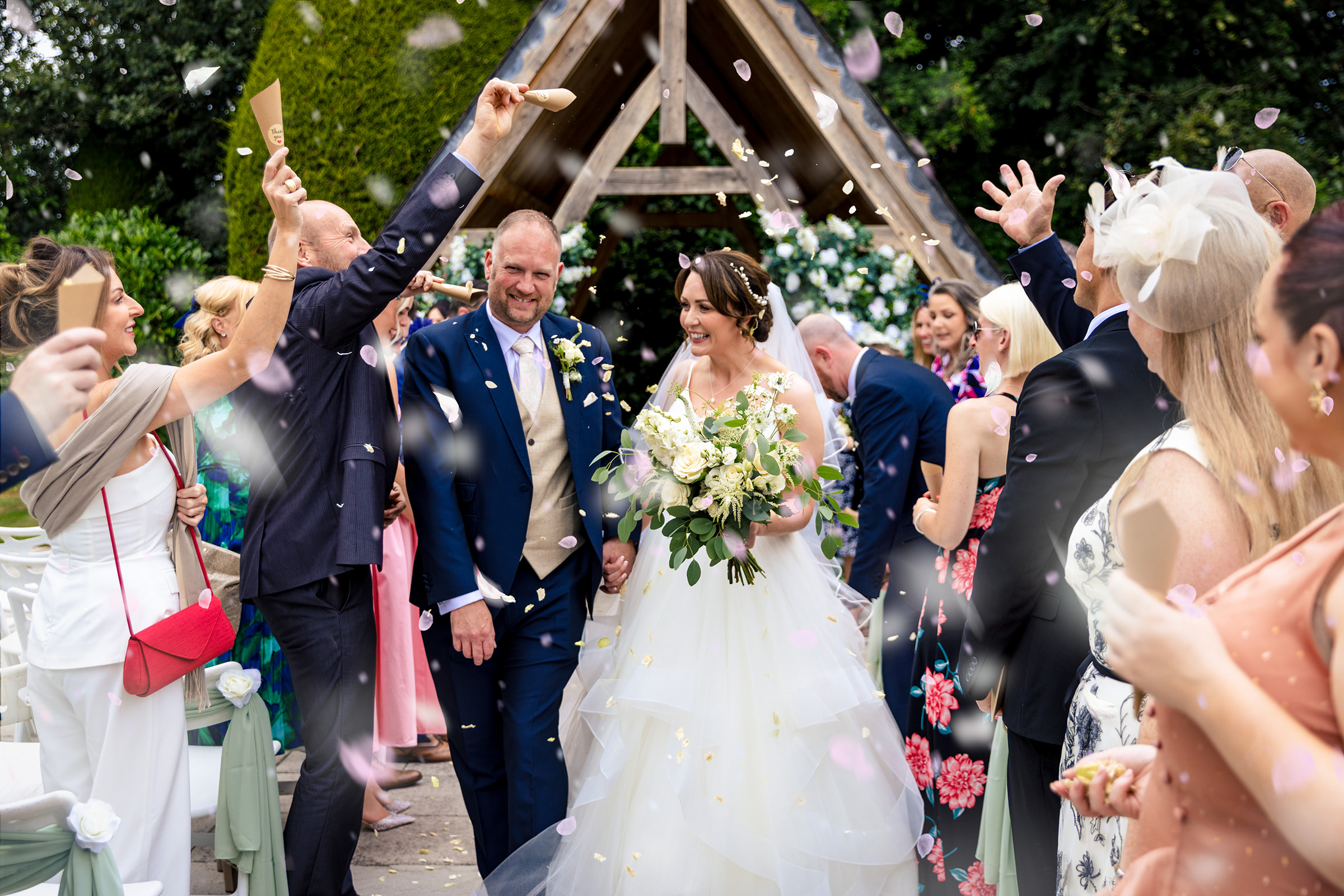 Kate and Andy enjoying the confetti at Highfield Hall