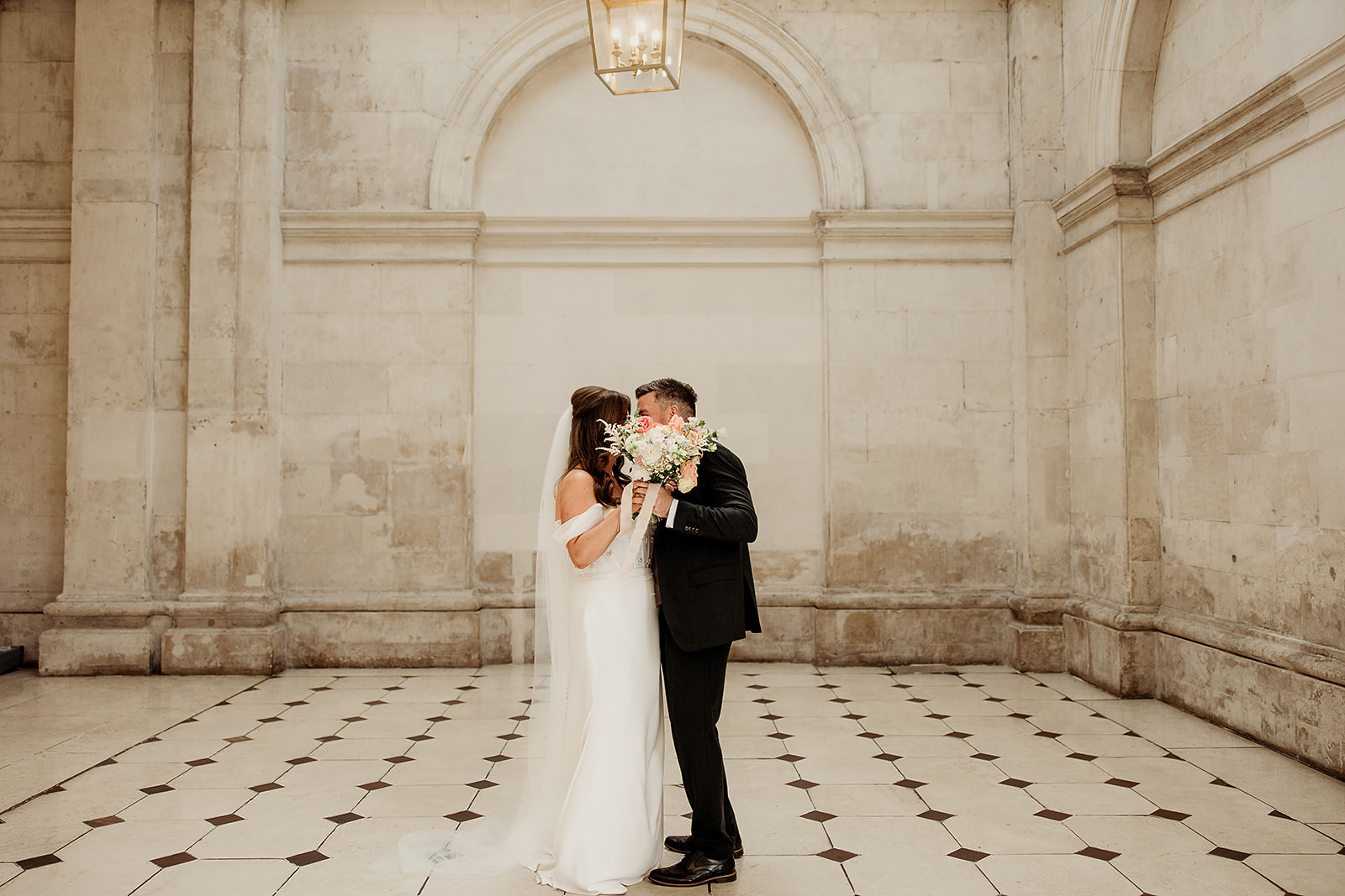 Claire and David sharing a quiet moment in the light-filled stone interior of Dublin City Hall