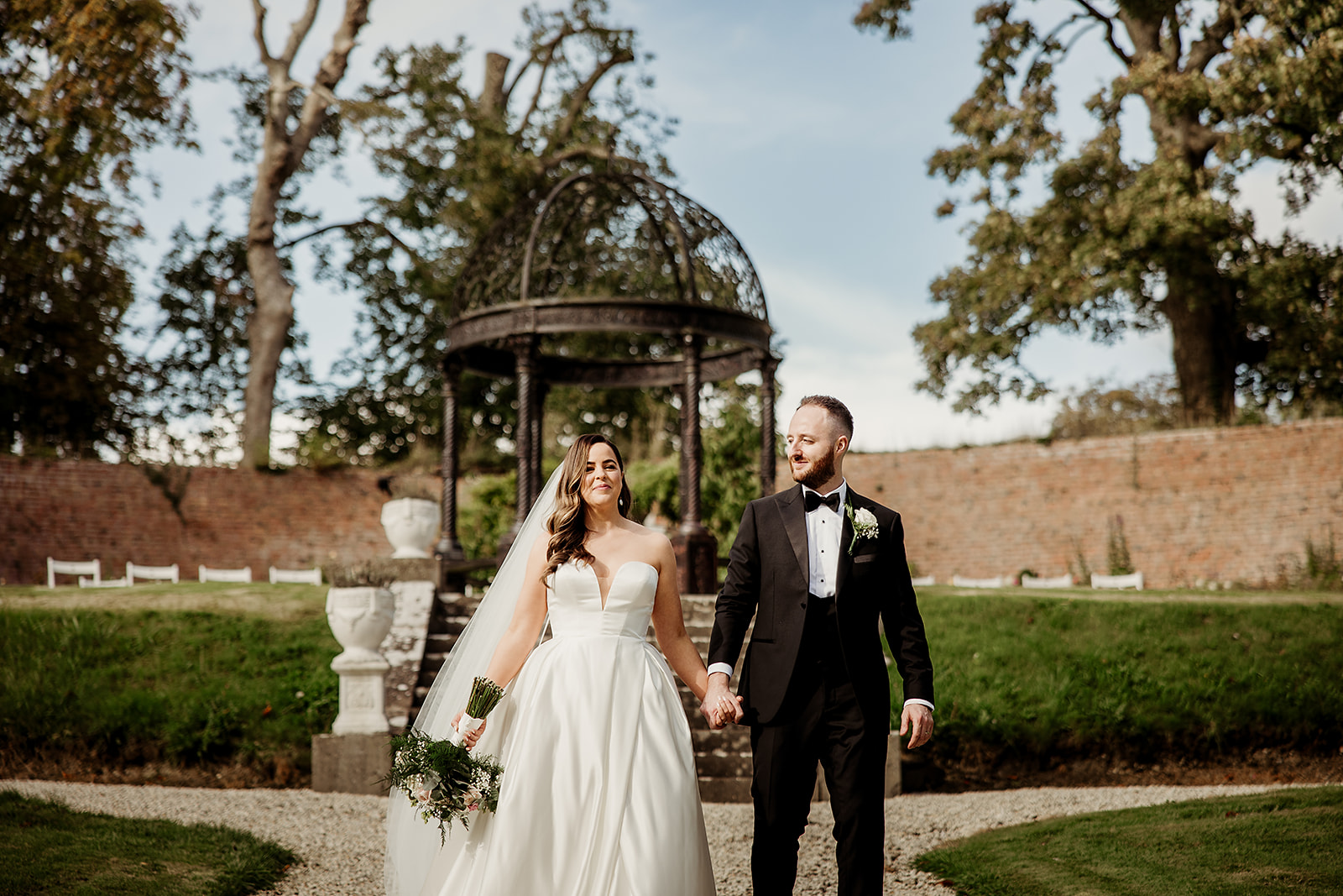 Linda and Michael holding hands in the Secret Garden at Boyne Hill.