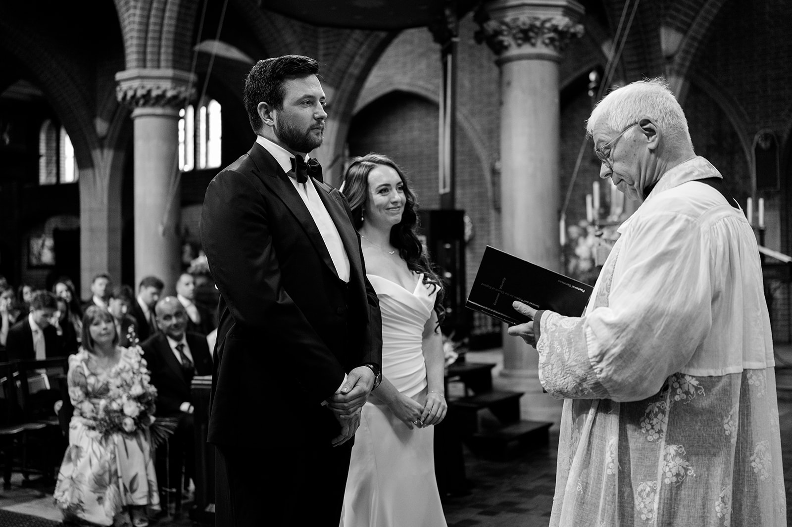 Chloe and Jon exchanging vows at the altar