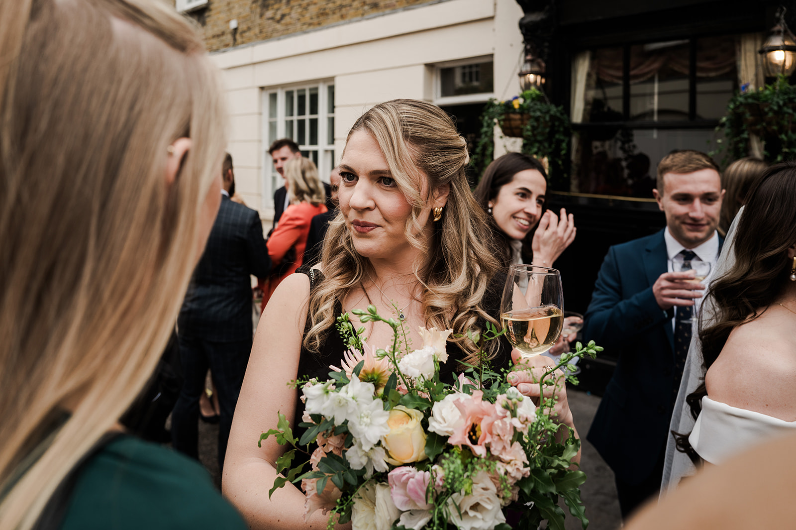 Guests mingling and celebrating at the pub reception
