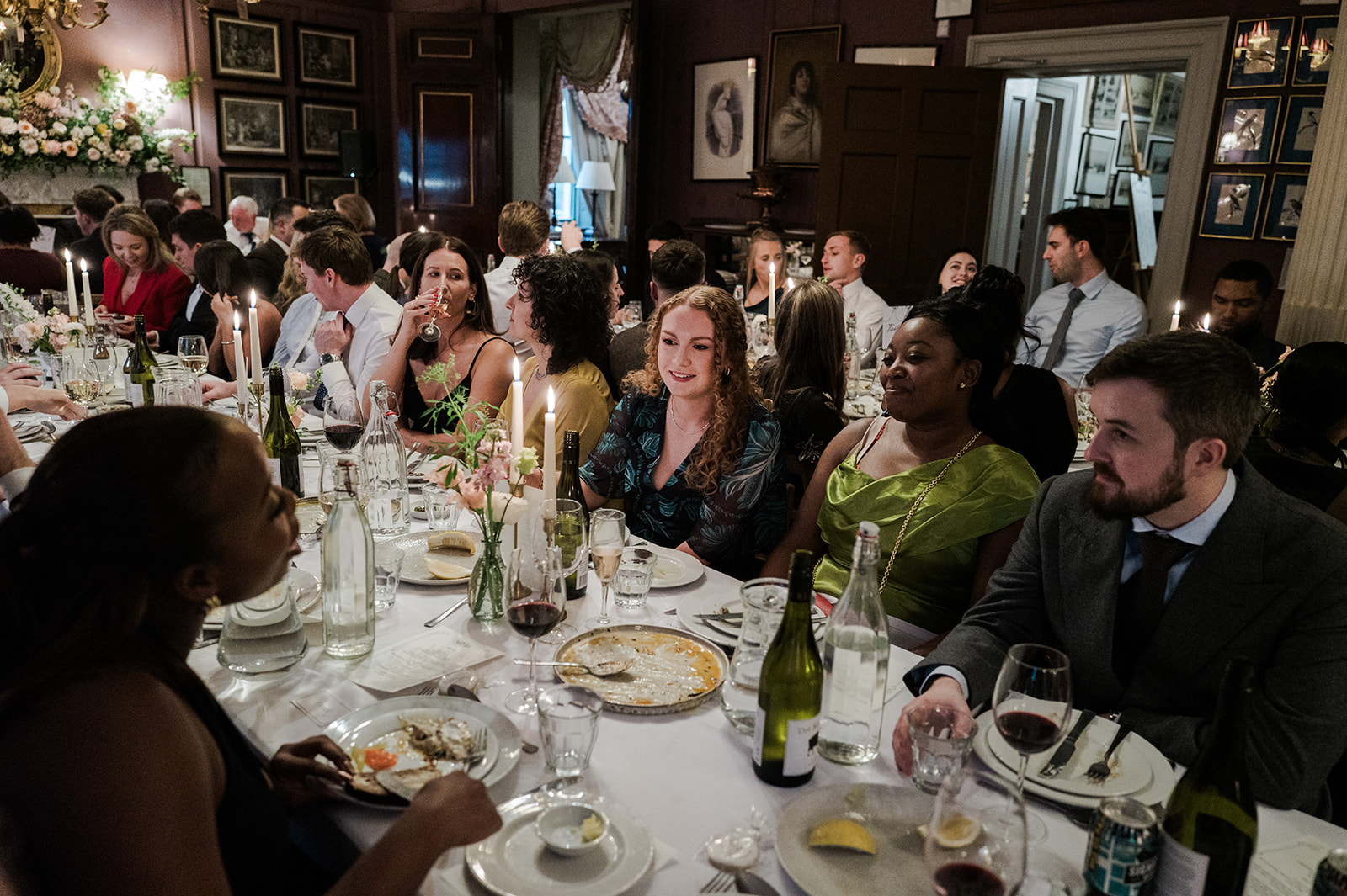 The candlelit dining room at Brunswick House set for the wedding dinner