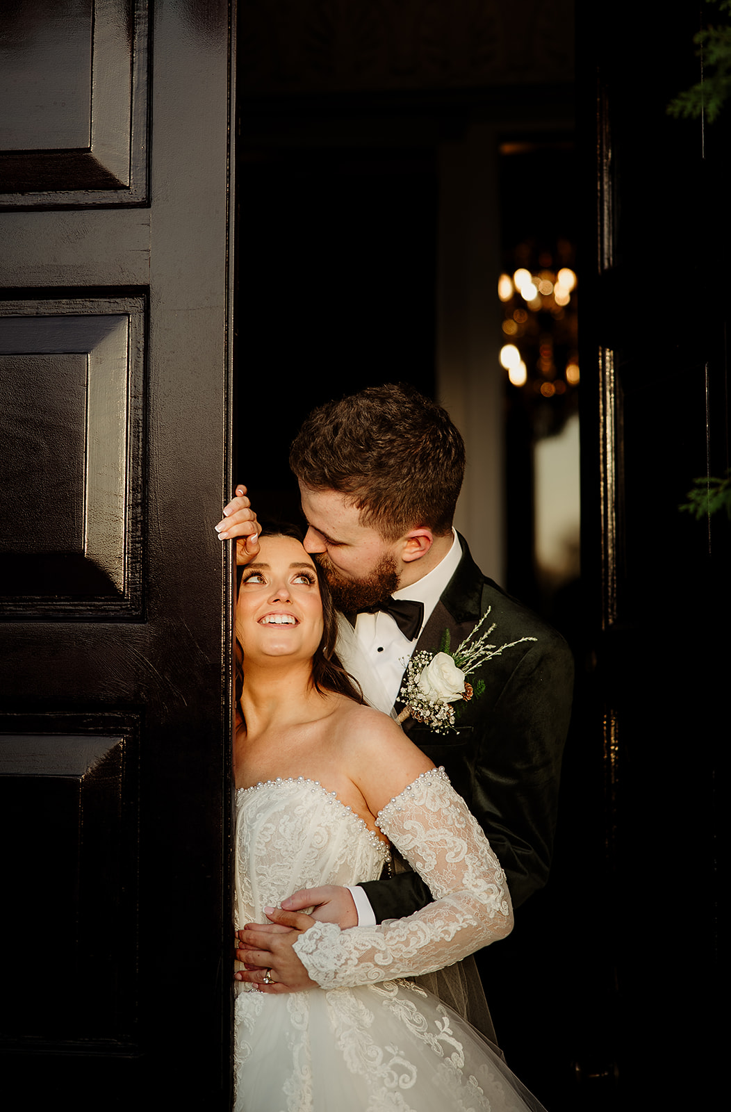 A kiss in the doorway after the ceremony