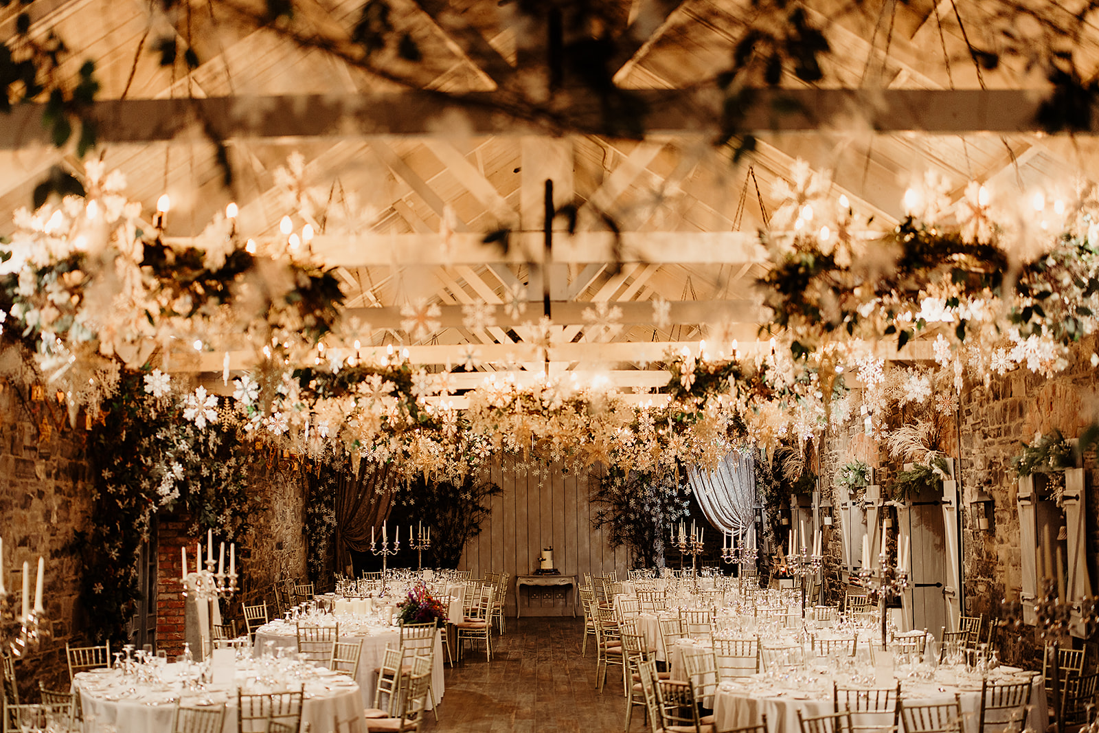 The candlelit wedding reception room at Ballymagarvey Village decorated for a winter wedding