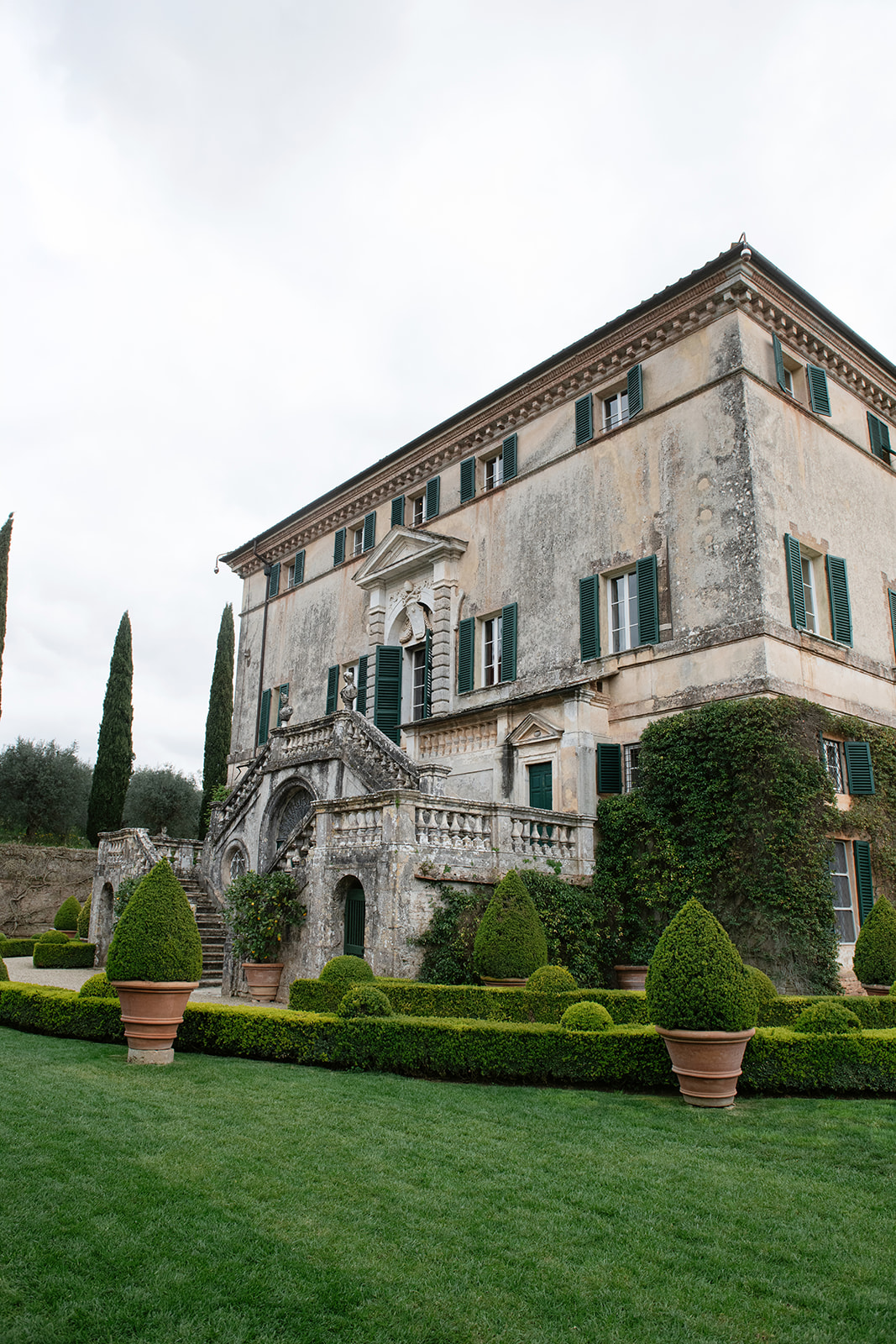 Renaissance villa facade with formal Italian gardens in Tuscany
