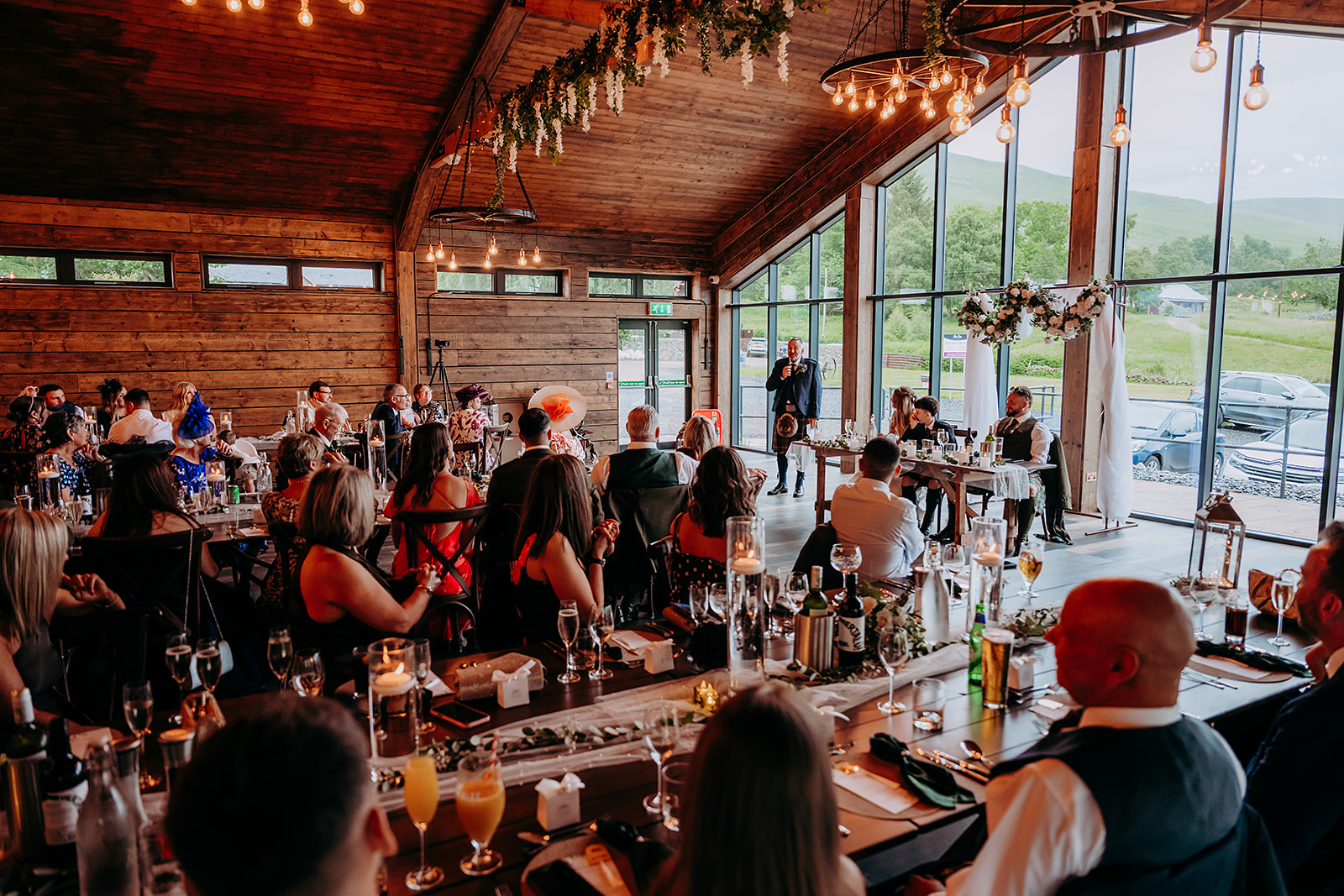 Wedding speeches inside the timber reception room at Glen Clova