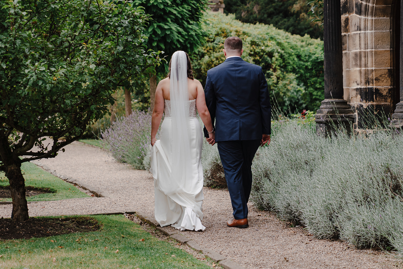 Annie and Joe walking through the gardens at East Riddlesden Hall
