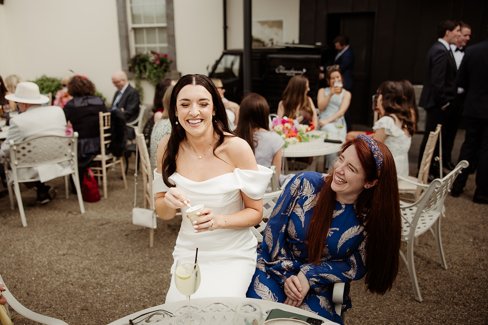 Ciara laughing with a guest during the drinks reception at Clonabreany House.