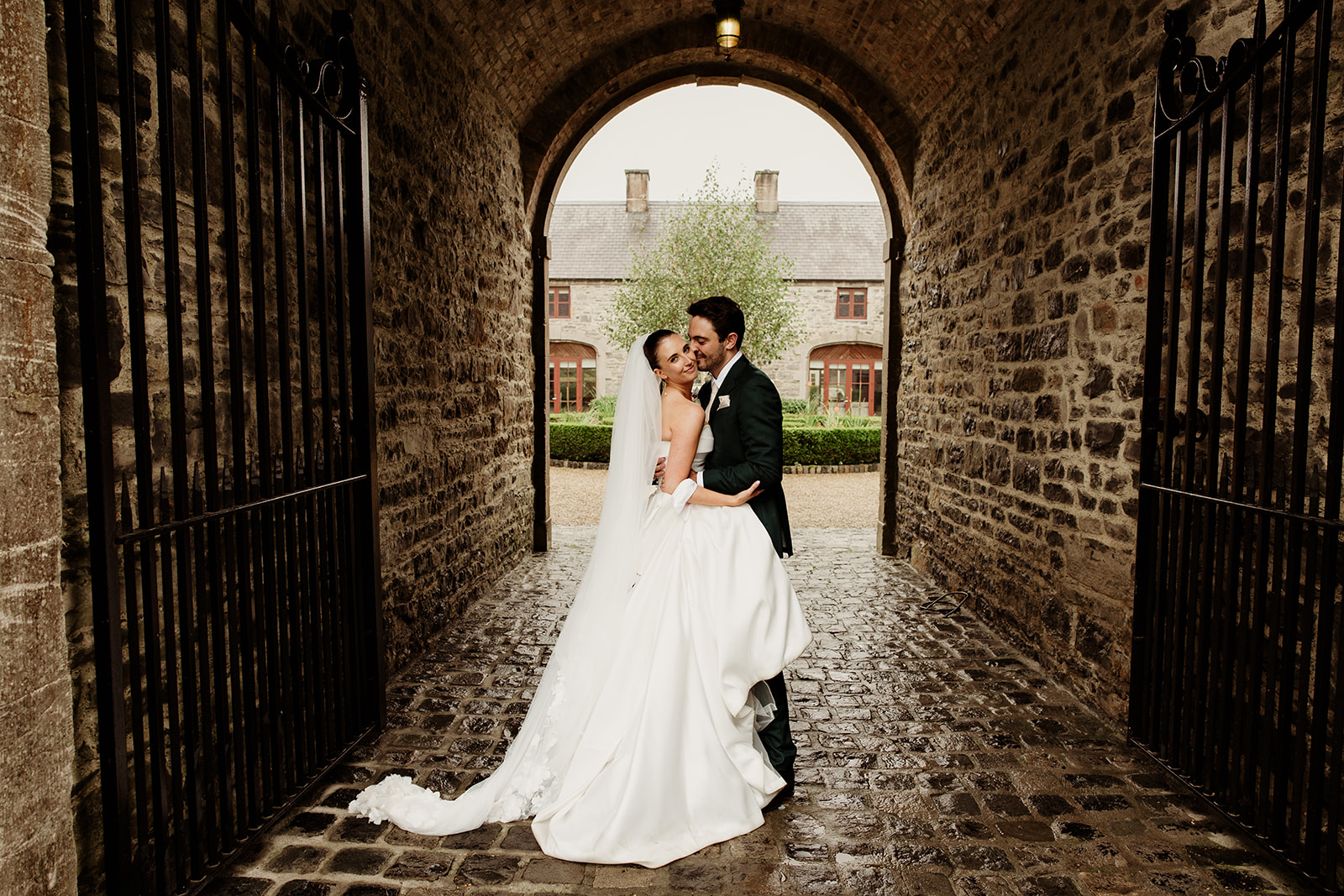 Megan and Rob together beneath the stone archway at Clonabreany House.