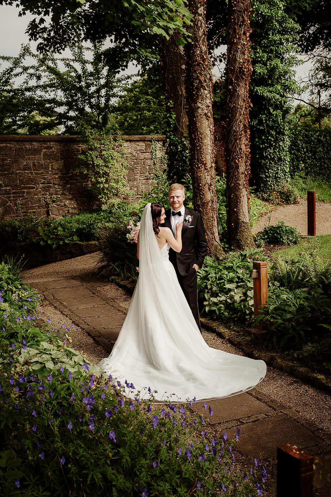 Corrine and David together beneath a tree in the gardens